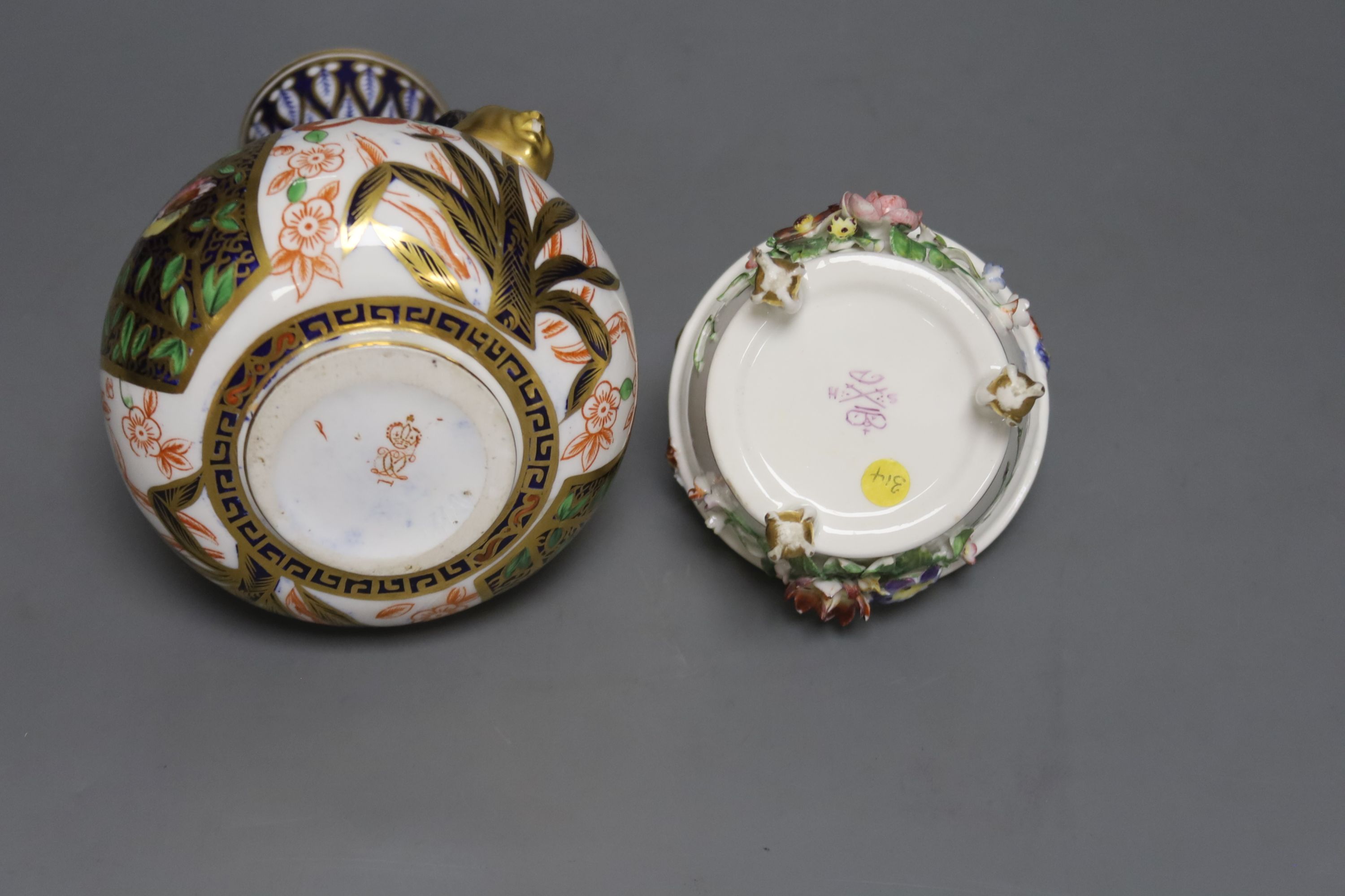 A Royal Crown Derby vase, with two mask head handles painted in Imari style, date code for 1882 and a Derby King Street pot pourri basket and cover c.1900, tallest 16cm